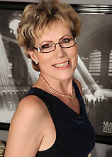 Elegant 57 Year Old Georgina C Uses Her Glasses To Toy Her Pussy